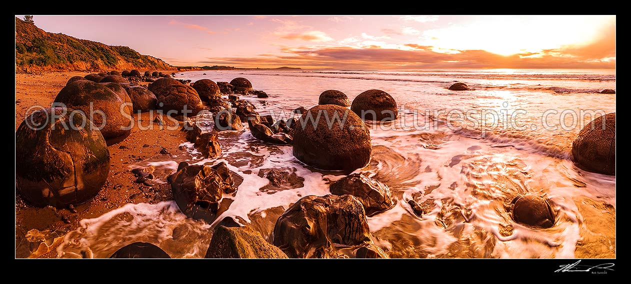 Image of Moeraki Boulders / Kaihinaki, 60 Million year old mudstone concretions in waves. A well known tourist destination. Panorama, Moeraki, Waitaki District, Canterbury Region, New Zealand (NZ) stock photo image