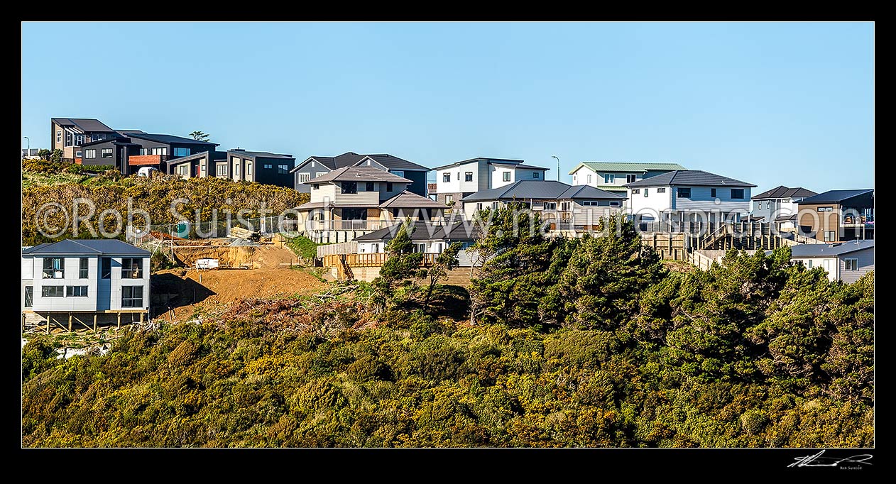 Image of New housing suburb development on old farmland. New homes under construction. Panorama, Wellington City District, Wellington Region, New Zealand (NZ) stock photo image