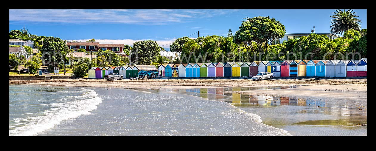 Image of Titahi Bay boatsheds, iconic brightly painted sheds on beach front at north end. Panorama, Titahi Bay, Porirua City District, Wellington Region, New Zealand (NZ) stock photo image