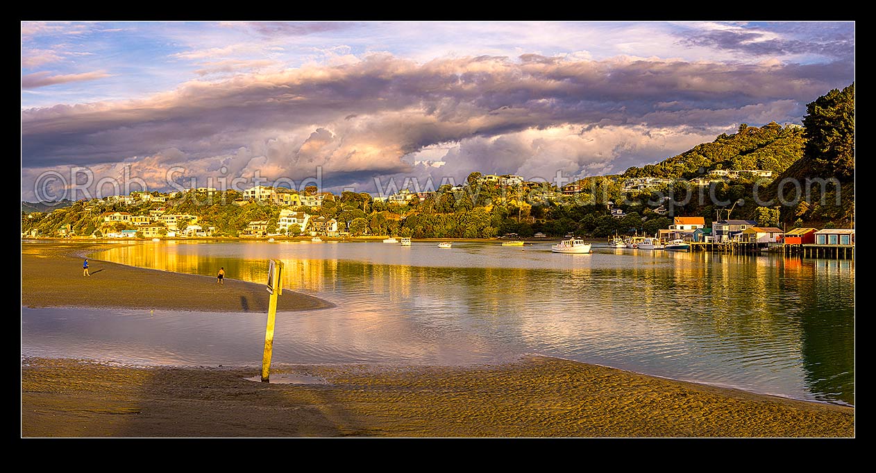 Image of Paremata boatsheds and moored vessels at Ivey Bay on Pauatahanui Inlet Arm of Porirua Harbour. Panorama, Paremata, Porirua City District, Wellington Region, New Zealand (NZ) stock photo image