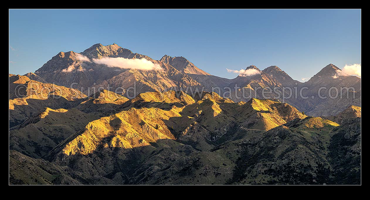 Image of Mt Tapuae-o-Uenuku (2885m) seen from the Cam River. Mt Alarm (2877m), Muzzle Pass, Mitre Peak (2621m), Trail Saddle, Mt Gladstone (in cloud) right. Panorama, Awatere Valley, Marlborough District, Marlborough Region, New Zealand (NZ) stock photo image