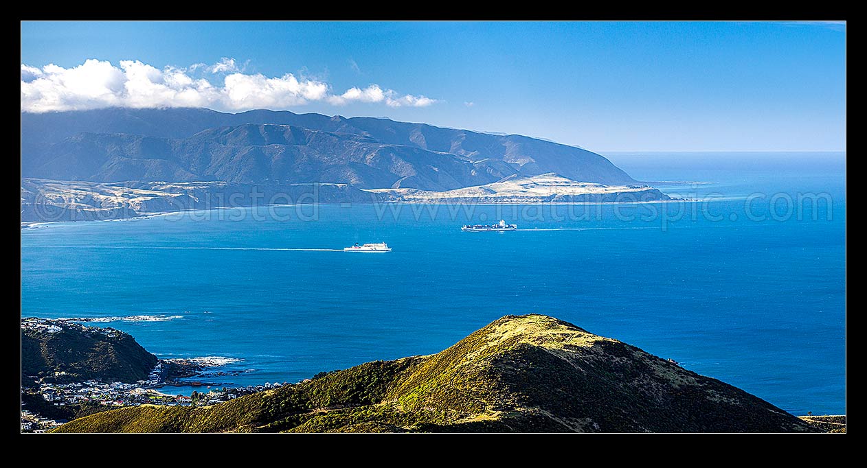 Image of Ships crossing at Wellington Harbour entrance, seen from Te Kopahau Reserve. Pencarrow, Baring and Turakirae Heads behind. Island Bay left. Panorama, Owhiro Bay, Wellington City District, Wellington Region, New Zealand (NZ) stock photo image