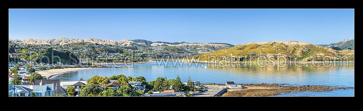 Image of Plimmerton suburb and beach, looking south to Mana, Paremata and Papakowhai suburbs and Porirua Harbour. Belmont Regional Park above. Panorama, Plimmerton, Porirua City District, Wellington Region, New Zealand (NZ) stock photo image