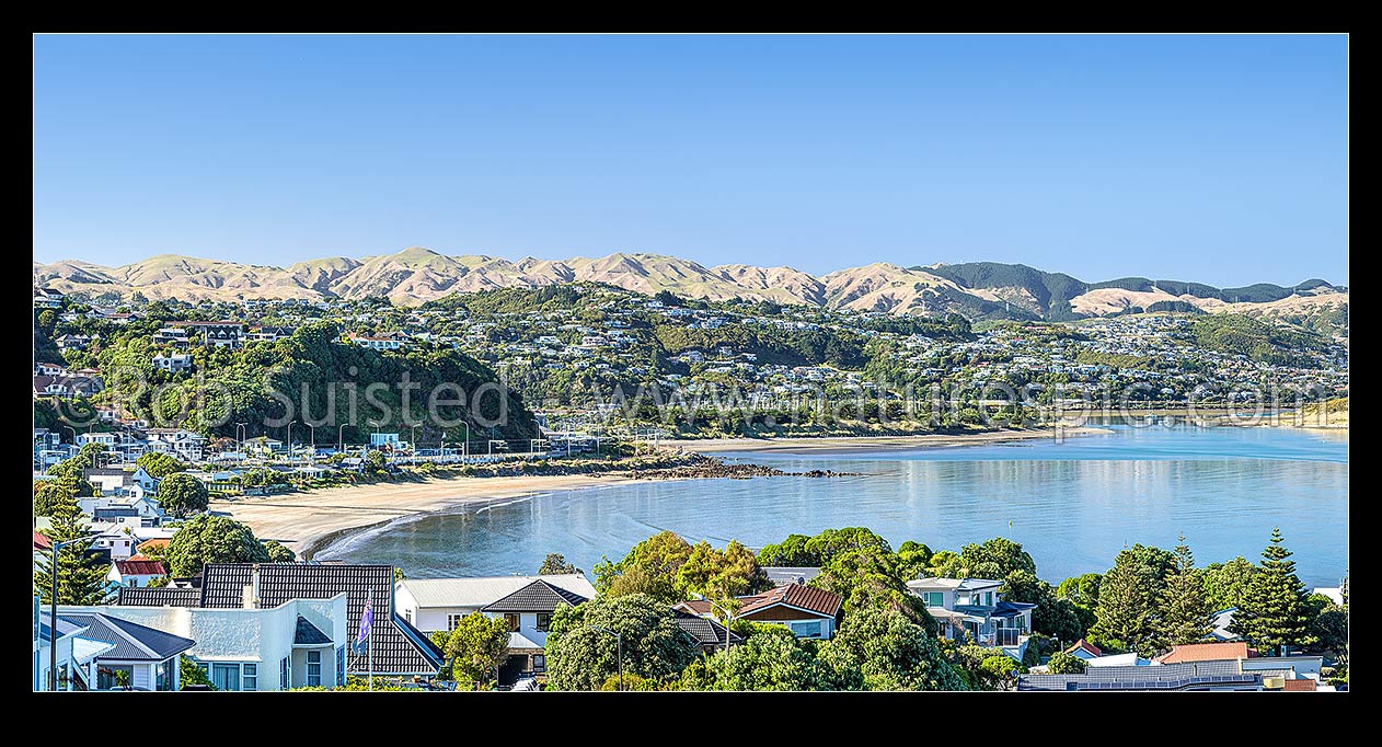 Image of Plimmerton suburb and beach, looking south to Mana, Paremata and Papakowhai suburbs and Porirua Harbour. Belmont Regional Park above. Panorama, Plimmerton, Porirua City District, Wellington Region, New Zealand (NZ) stock photo image