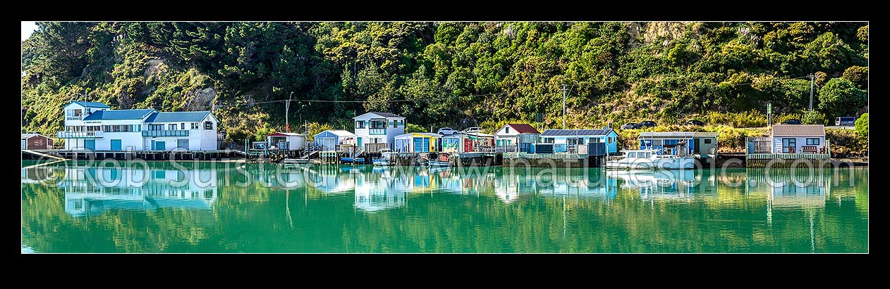 Image of Paremata boatsheds and boating club reflected at Ivey Bay on the Pauatahanui Inlet arm of Porirua Harbour. Panorama, Paremata, Porirua City District, Wellington Region, New Zealand (NZ) stock photo image