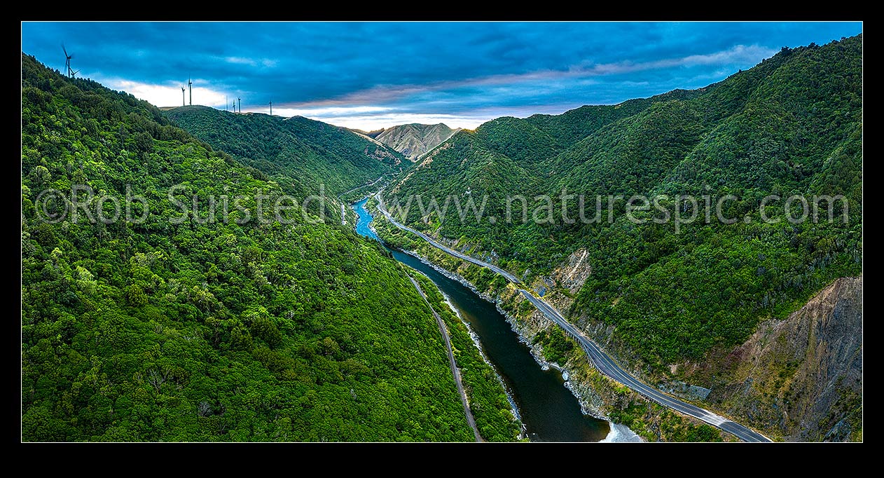 Image of Manawatu River passing through Manawatu Gorge and Scenic Reserve at dawn. Aerial view over railway and the now disused highway. Looking East. Panorama, Ashhurst, Palmerston North City District, Manawatu-Wanganui Region, New Zealand (NZ) stock photo image