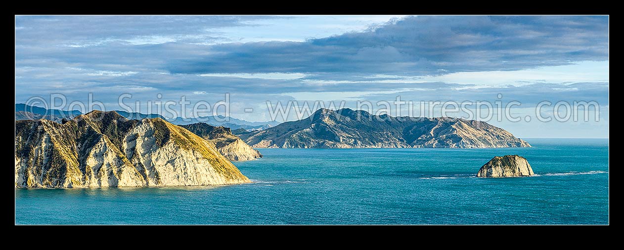 Image of Tolaga Bay northern cliffs and Te Karaka Point (left), looking north past Paerau Point to Marau Peak (277m) and Marau Point right. Panorama, Tolaga Bay, Gisborne District, Gisborne Region, New Zealand (NZ) stock photo image