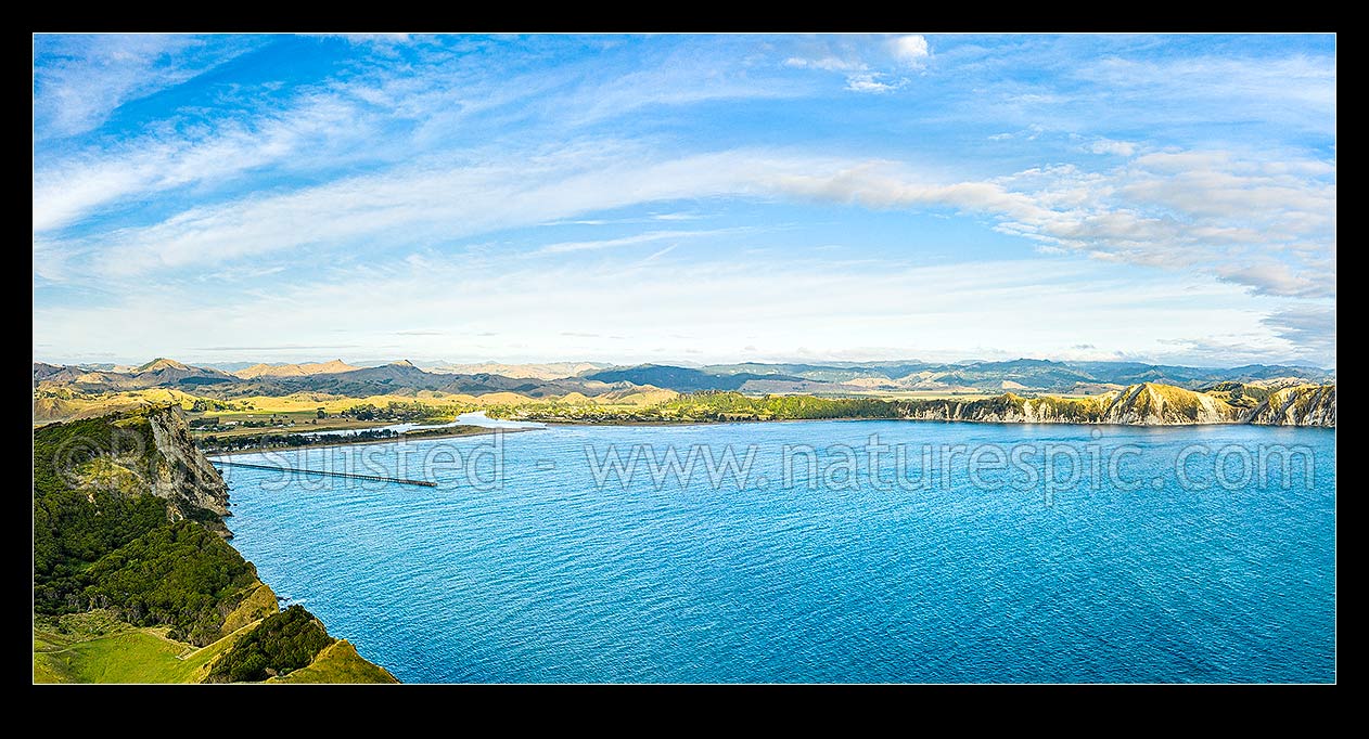 Image of Tolaga Bay aerial panorama. Uawa River and township at centre left, Tolaga Bay, Gisborne District, Gisborne Region, New Zealand (NZ) stock photo image