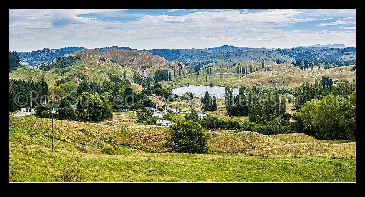 Image of Tiniroto village with Lake Rotokaha behind, on Tiniroto Road, inland Poverty Bay rural farming district. Panorama, Tiniroto, Gisborne District, Gisborne Region, New Zealand (NZ) stock photo image