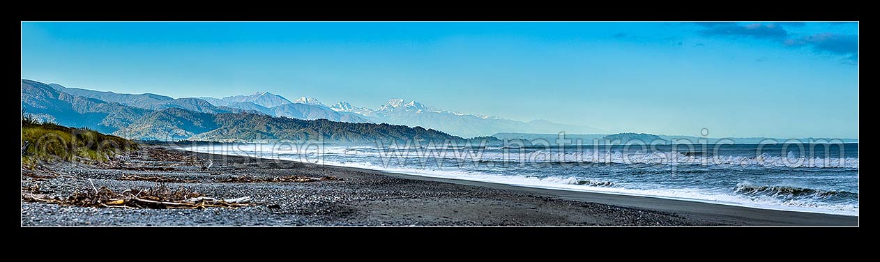 Image of Southern Alps Main Divide above Westland beach near Hokitika, at dawn. Aoraki Mt Cook (3754m) and Mt Tasman (3497m) centre. Panorama, Hokitika, Westland District, West Coast Region, New Zealand (NZ) stock photo image