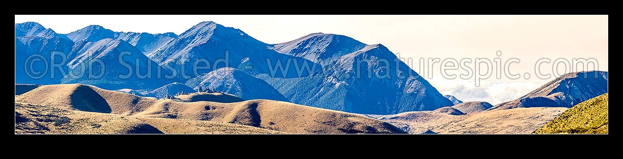 Image of Castle Hill (920m) with limestone boulders (centre left) amongst alpine landscape, with Mt Manson (1859m) in Craigieburn Range above. Panorama, Castle Hill, Selwyn District, Canterbury Region, New Zealand (NZ) stock photo image