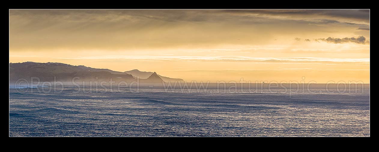 Image of Otago Peninsula dawn from Brighton Beach, looking past Back Head point and White Island (centre right) towards Otago Peninsula beyond. Panorama, Brighton, Dunedin City District, Otago Region, New Zealand (NZ) stock photo image