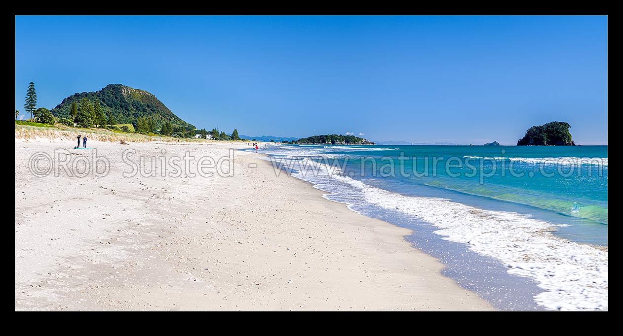 Image of Papamoa Beach on a summer day, looking west towards Mt Maunganui Mauao and Motuotau Island (right). Panorama, Papamoa Beach, Tauranga District, Bay of Plenty Region, New Zealand (NZ) stock photo image