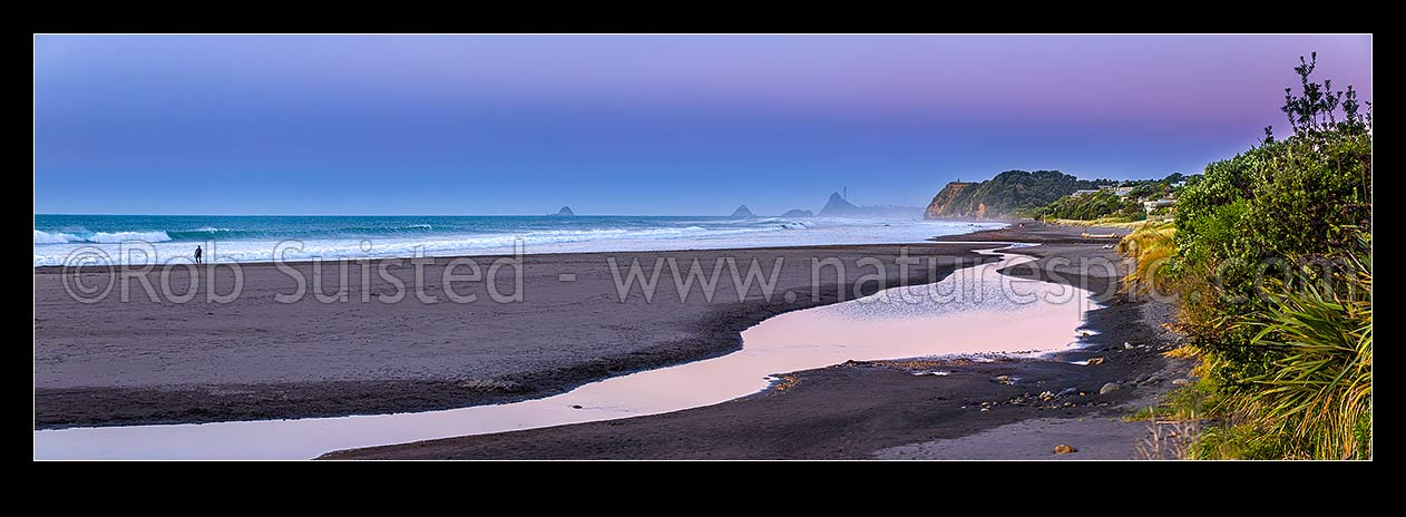 Image of Oakura Beach & Waimoku Stream on a calm moody twilight. Nga Motu Sugar Loaf Islands, Paritutu Rock (154m) and power station chimney behind. Panorama, Oakura, New Plymouth District, Taranaki Region, New Zealand (NZ) stock photo image