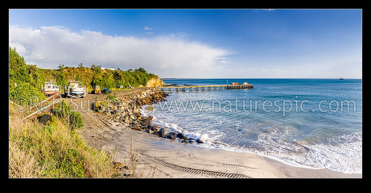 Image of Owenga Wharf at Owenga. Panorama showing commercial fishing vessels and boats onshore, Chatham Islands Rekohu, Chatham Islands District, Chatham Islands Region, New Zealand (NZ) stock photo image