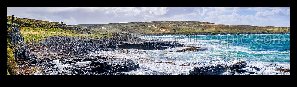 Image of Ohira Bay basalt columns in Petre Bay, with visitors visiting on a typically windy day on Rekohu. Panorama view, Chatham Islands Rekohu, Chatham Islands District, Chatham Islands Region, New Zealand (NZ) stock photo image