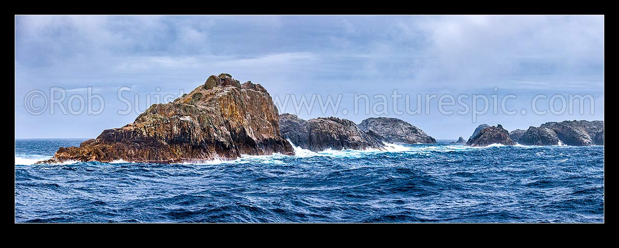 Image of Bounty Islands main group panorama from the east. Lion Island (left), Ruatara Is (behind), Dog Rock (in gap), Ranfurly, Tunnel, and Depot Island far right. Moutere Hauriri, Bounty Islands, NZ Sub Antarctic District, NZ Sub Antarctic Region, New Zealand (NZ) stock photo image