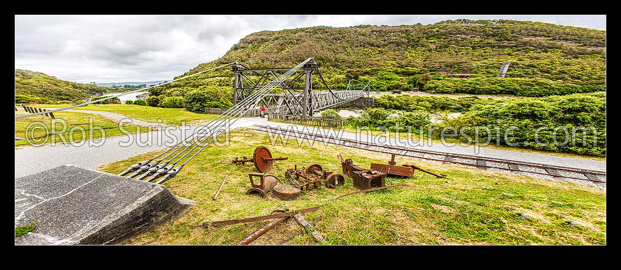 Image of Brunner Suspension Bridge over the Grey River at the historic Brunner Mine Site, one of NZ's earliest industrial sites from 1860's onwards. Stillwater. Panorama, Taylorville, Grey District, West Coast Region, New Zealand (NZ) stock photo image