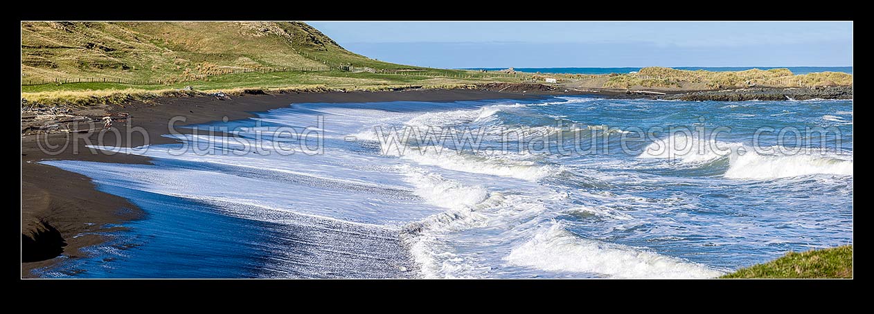 Image of Te Awaiti surf and waves rolling into the Oterei River Mouth at Tora beach. Te Awaiti Station beyond, Tora, South Wairarapa District, Wellington Region, New Zealand (NZ) stock photo image